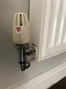 White radiator with thermostatic radiator valve