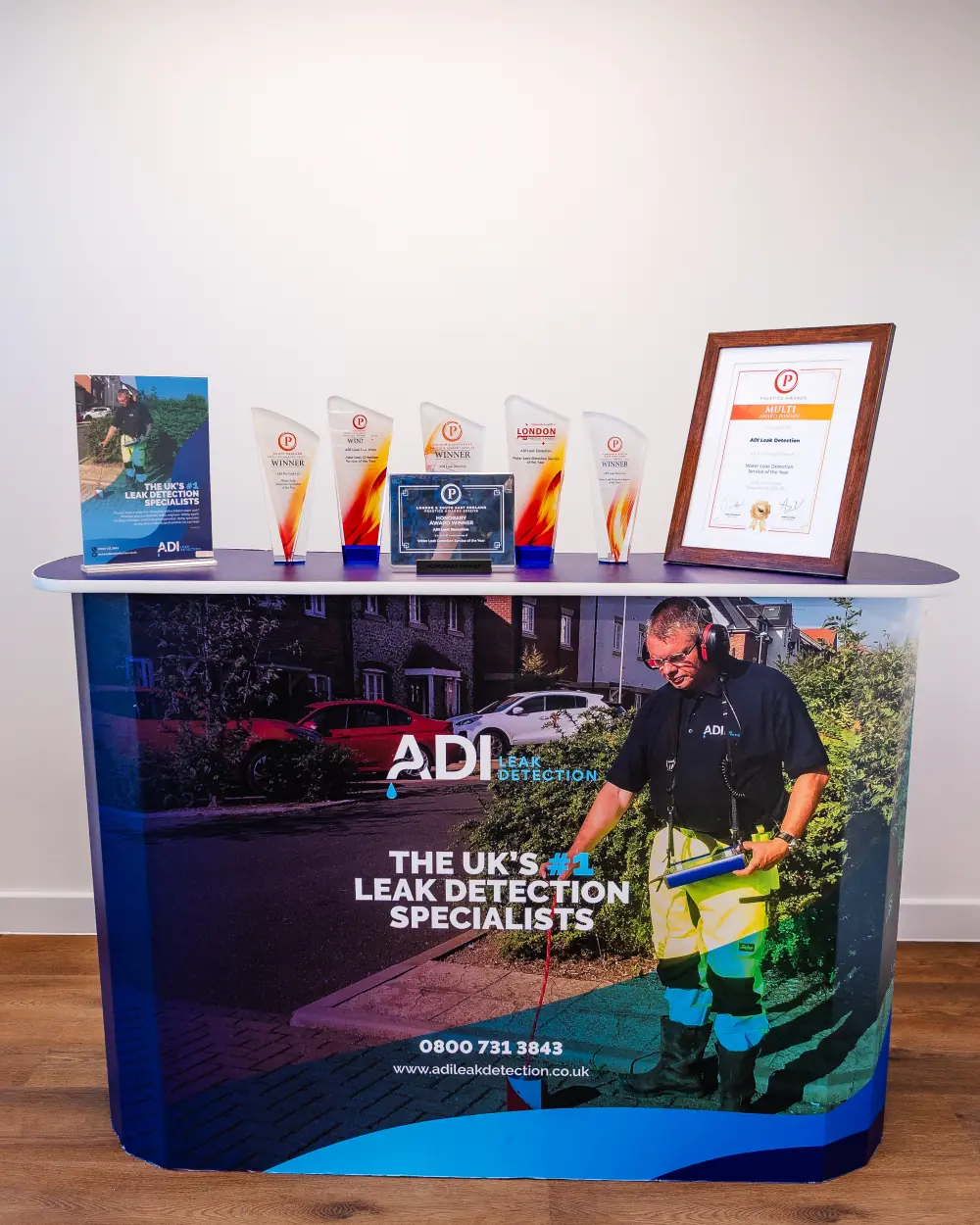 ADI’s Prestige Awards trophies and certificate on its branded stand