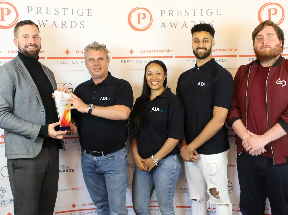 ADI Leak Detection staff receiving a Corporate LiveWire Prestige Award at the awards presentation.