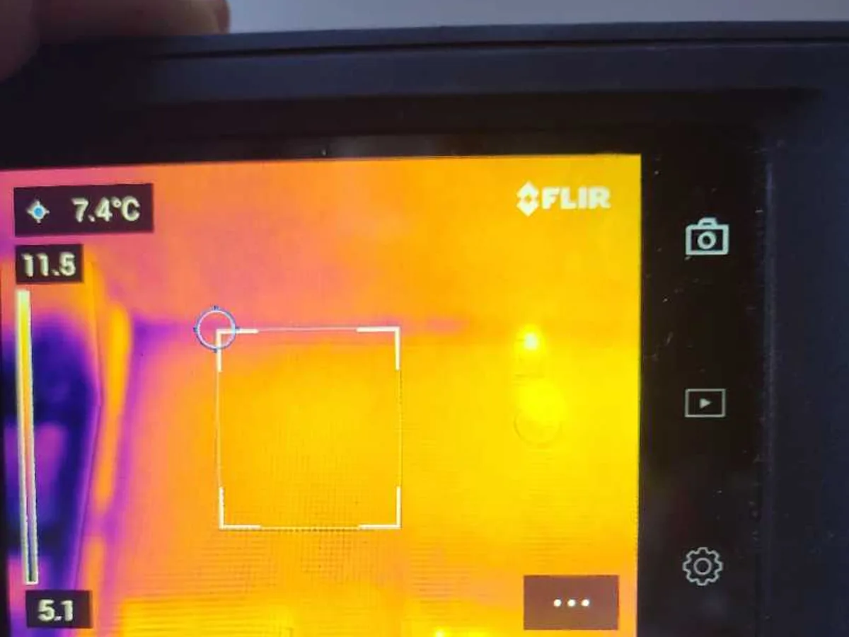 Thermal imaging camera screen showing heat signature during an internal mains leak detection survey at a property in ST3