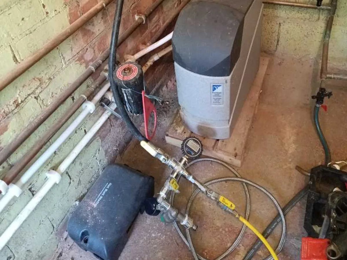 tracer gas equipment connected to heating system in plant room during leak detection