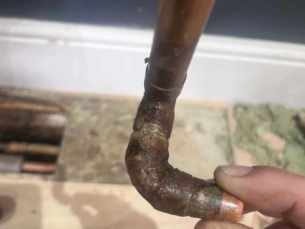 leak found at heavily corroded 15mm copper end-feed elbow removed from heating pipework
