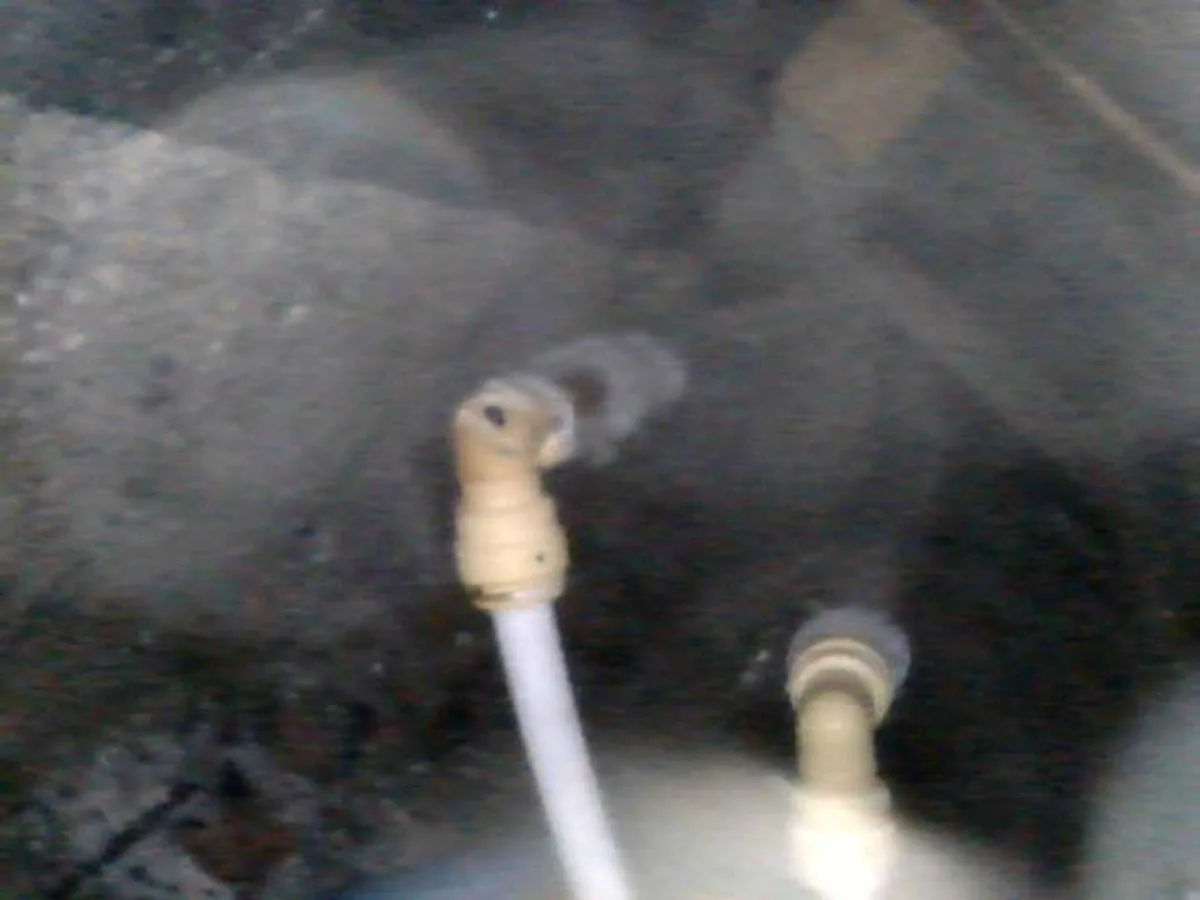 leak found at rodent-damaged 15mm push-fit elbow beneath hallway floor viewed via endoscope