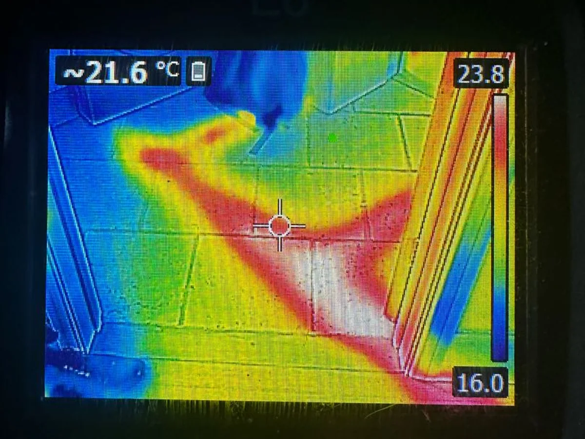 thermal imaging camera screen showing floor and radiator pipework during leak detection survey