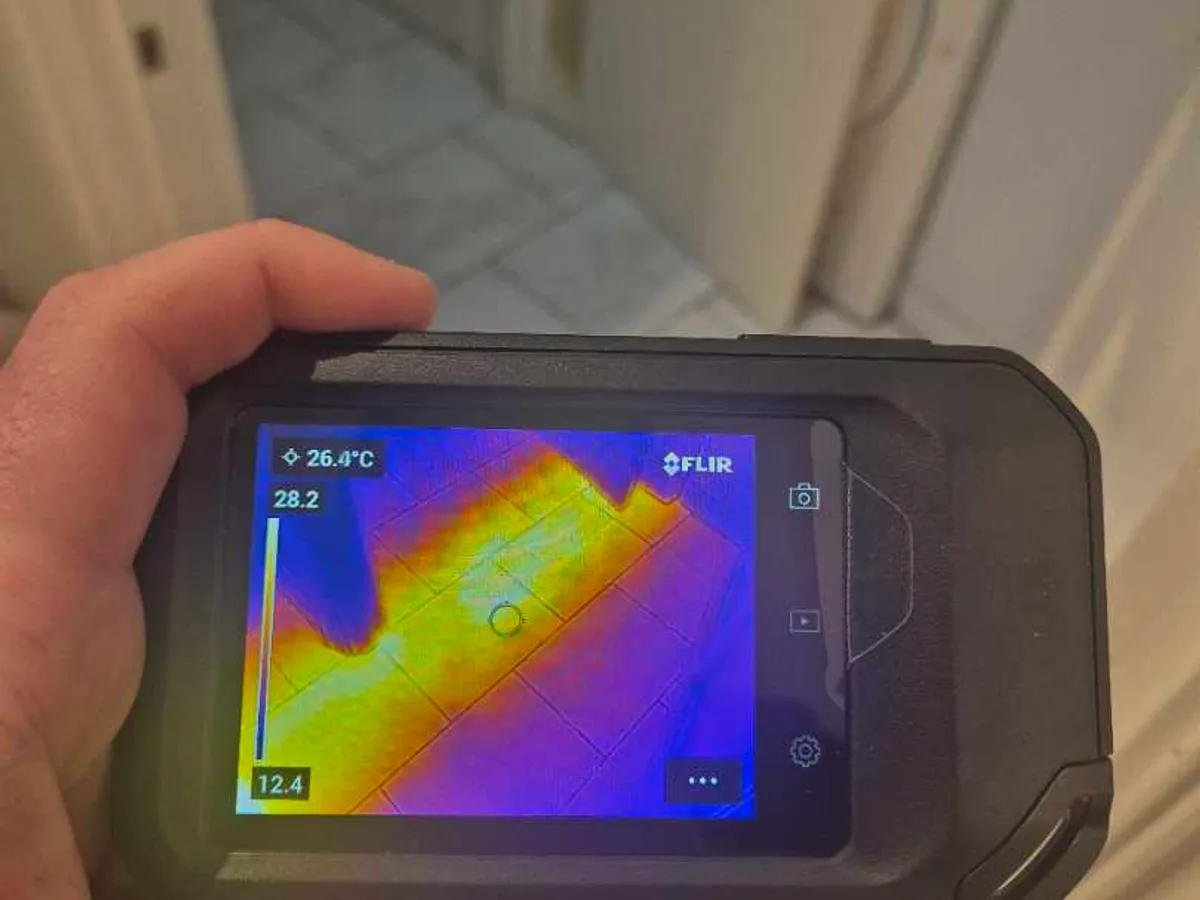 thermal imaging camera displaying floor heat signature during leak detection survey