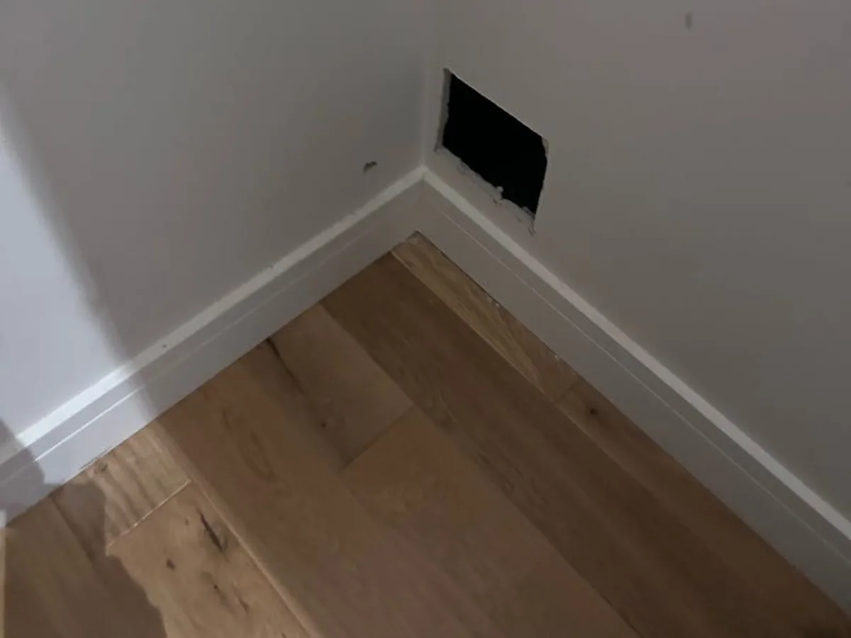 leak found at access hole cut in plasterboard wall near skirting to expose damaged fitting