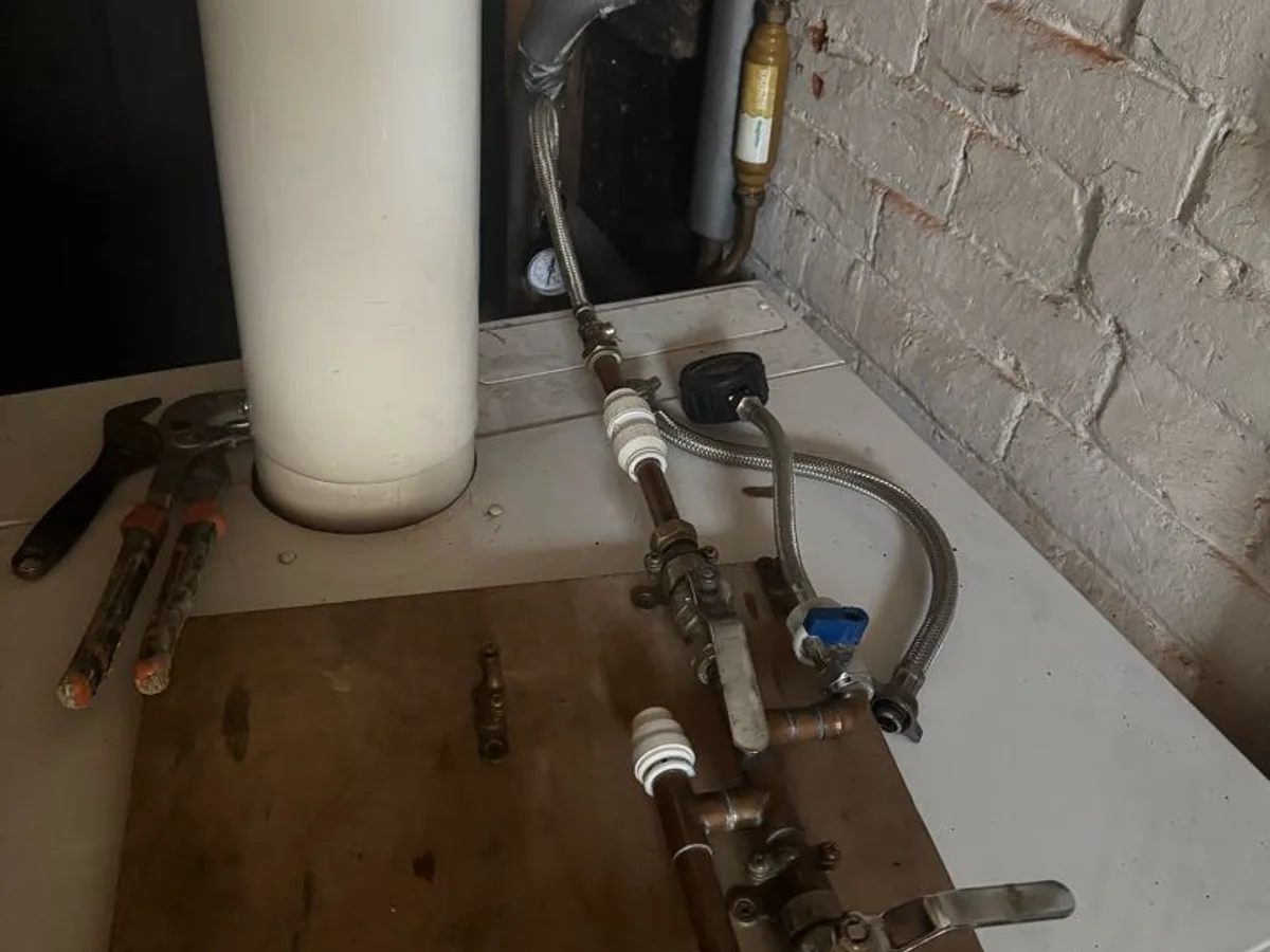 filling loop and heating pipework connections with tracer gas equipment in use during investigation