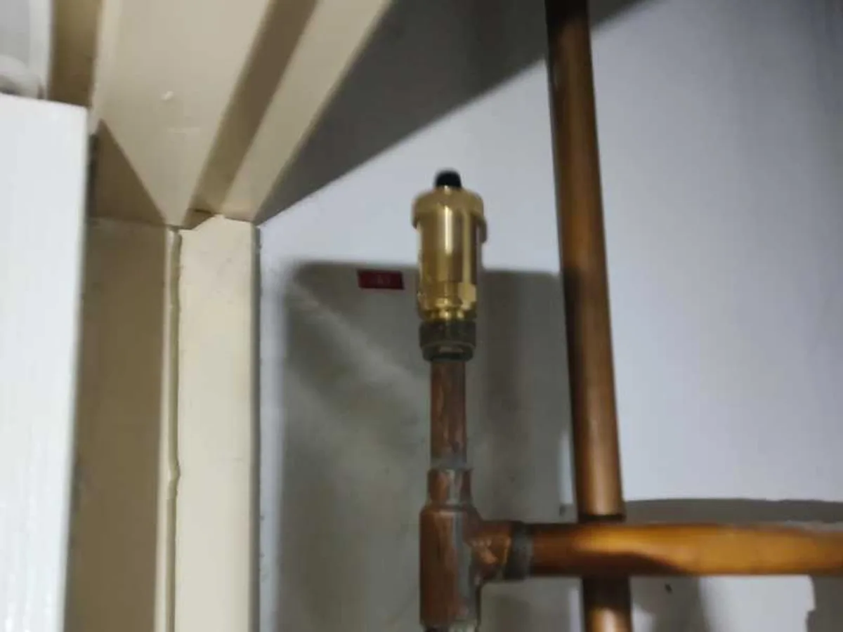 new brass automatic air vent fitted to copper pipework in stair cupboard as repair completed