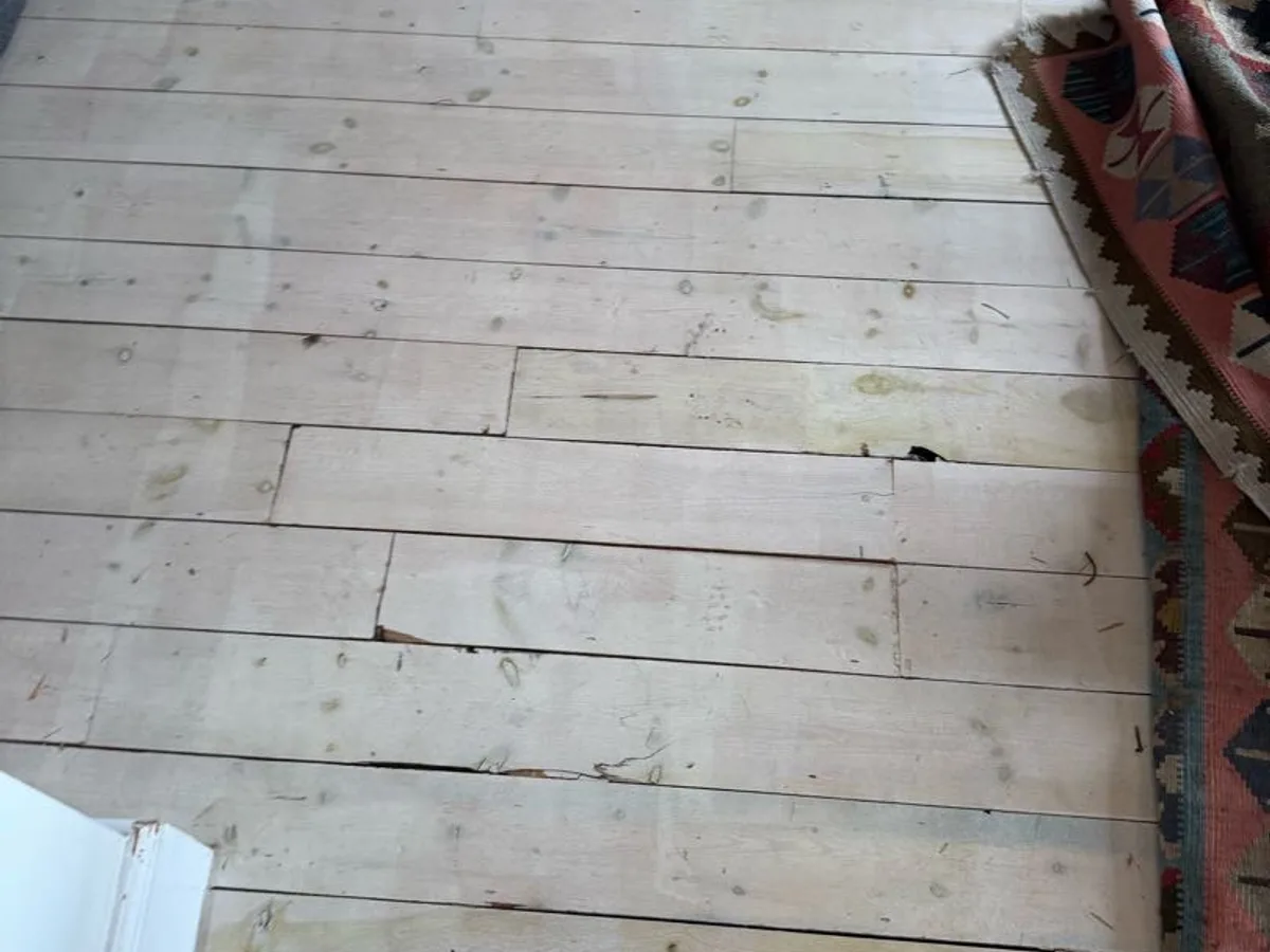 timber floorboards relaid and area reinstated after repair to underfloor heating pipe