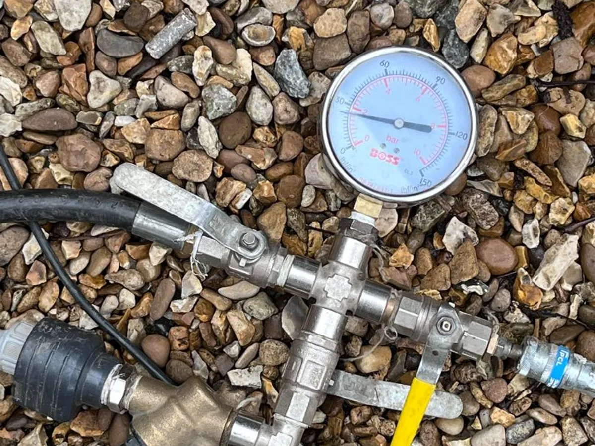 compressed air pressure test rig with gauges in use during investigation