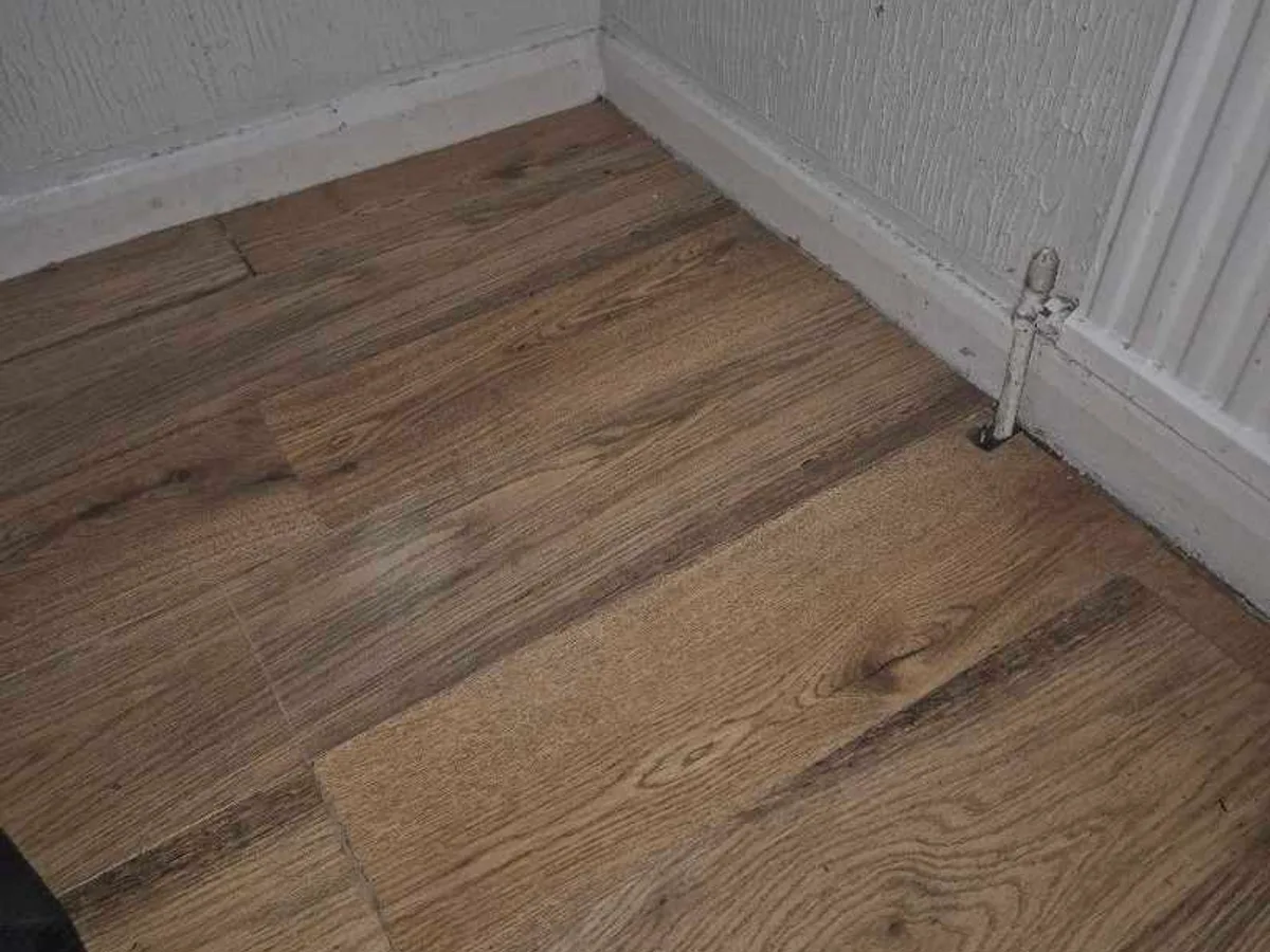 dining room floor covering laid over repaired area reinstated after central heating repair