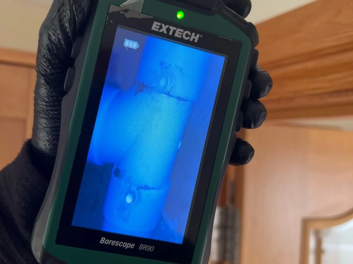 borescope camera screen showing interior of waste pipe during leak detection survey