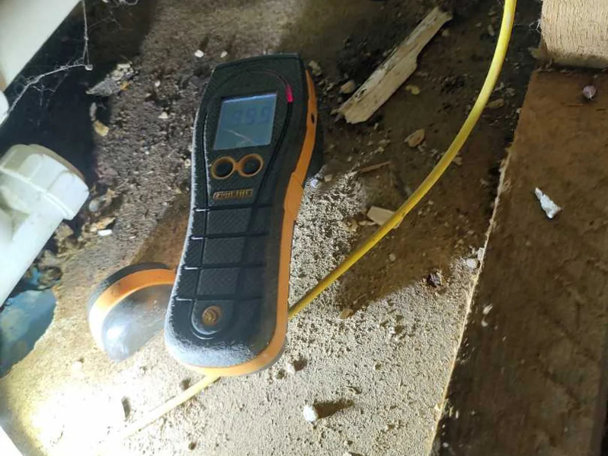 acoustic listening device placed on exposed subfloor during leak detection survey