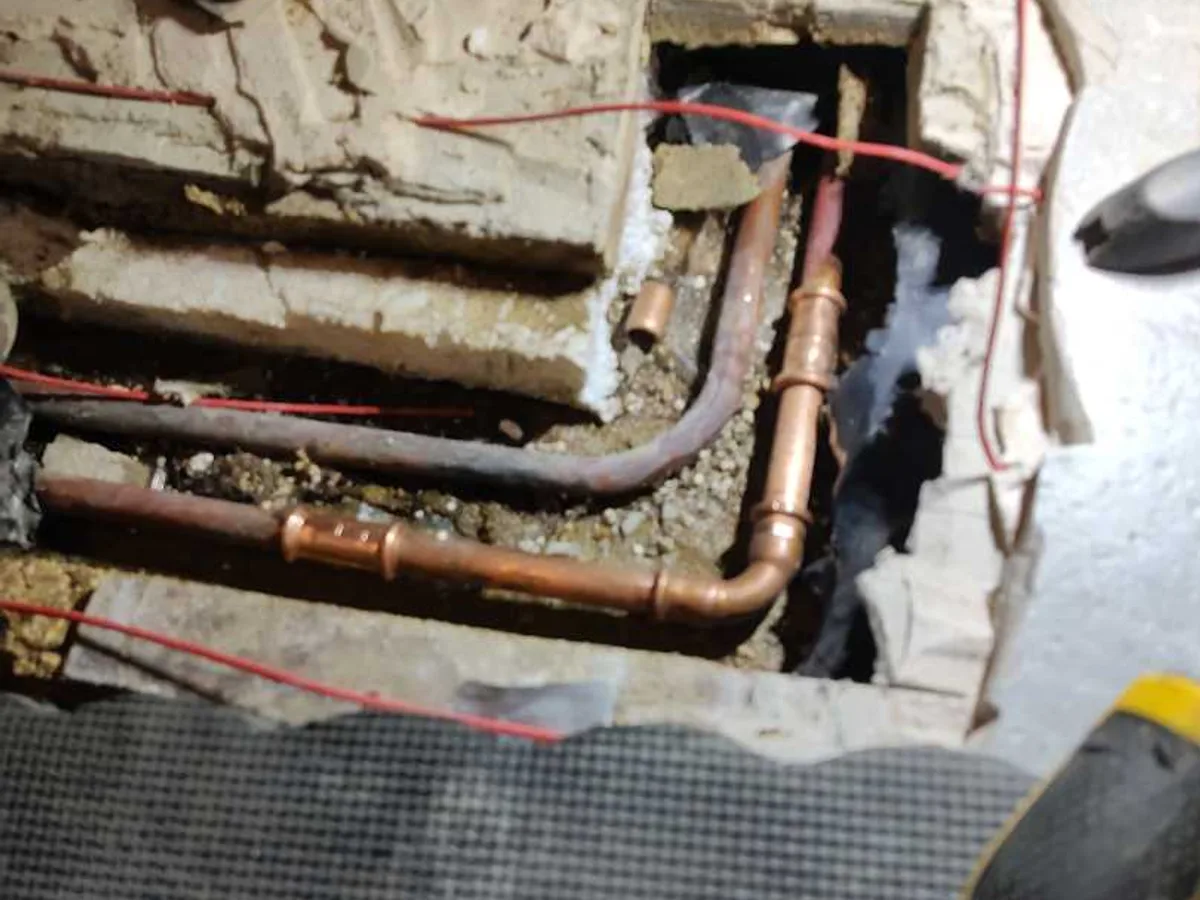 new 15mm copper pipe and fittings installed as repair completed beneath en suite floor