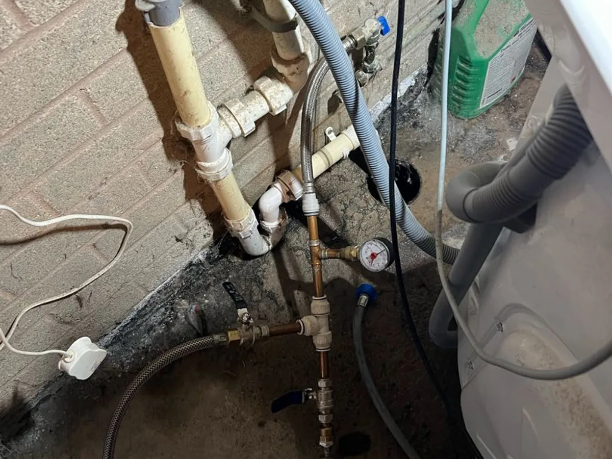 tracer gas and pressure testing equipment connected to pipework during leak detection