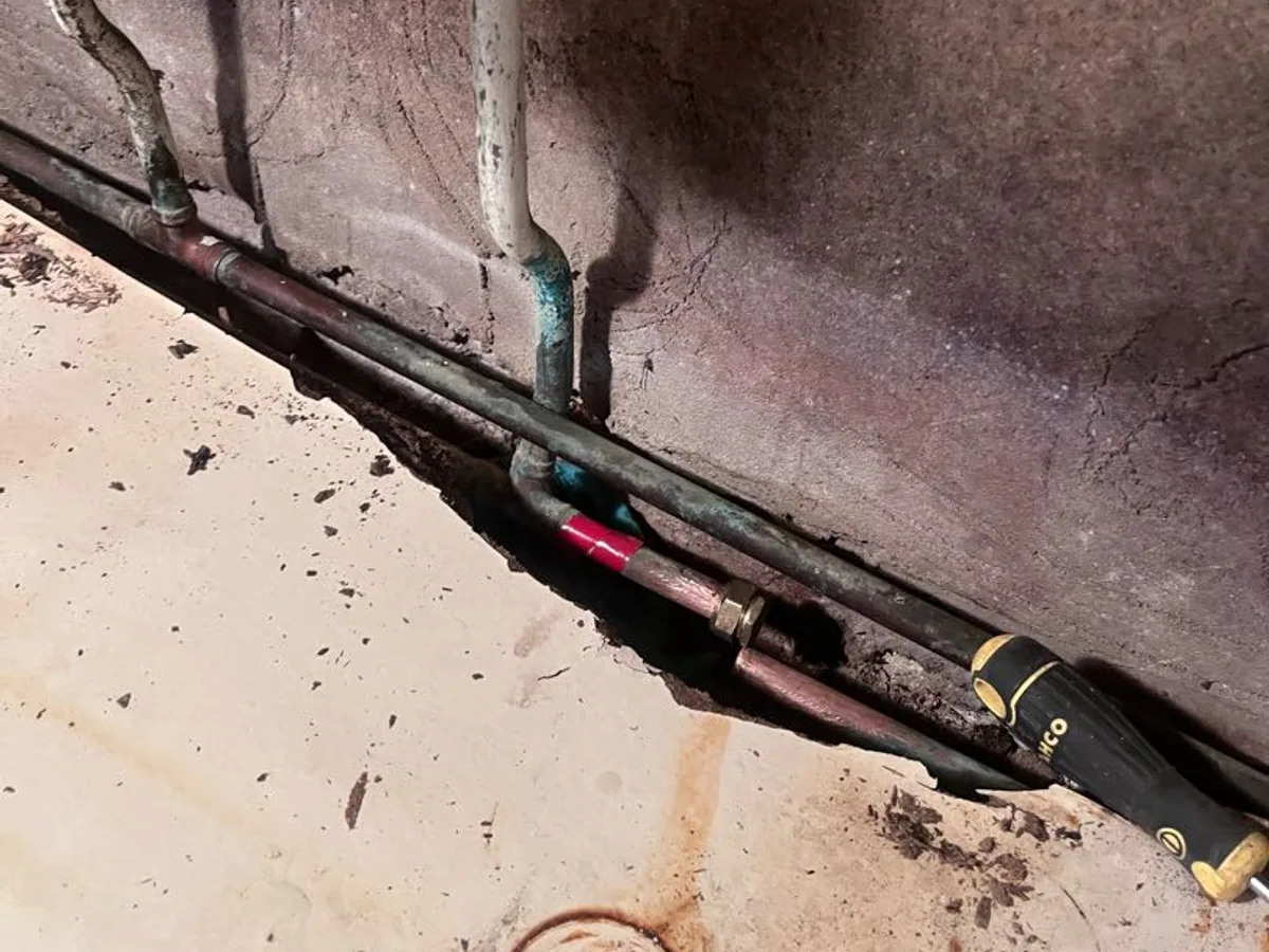 leak located at corroded copper hot water dead leg pipework beneath kitchen sink