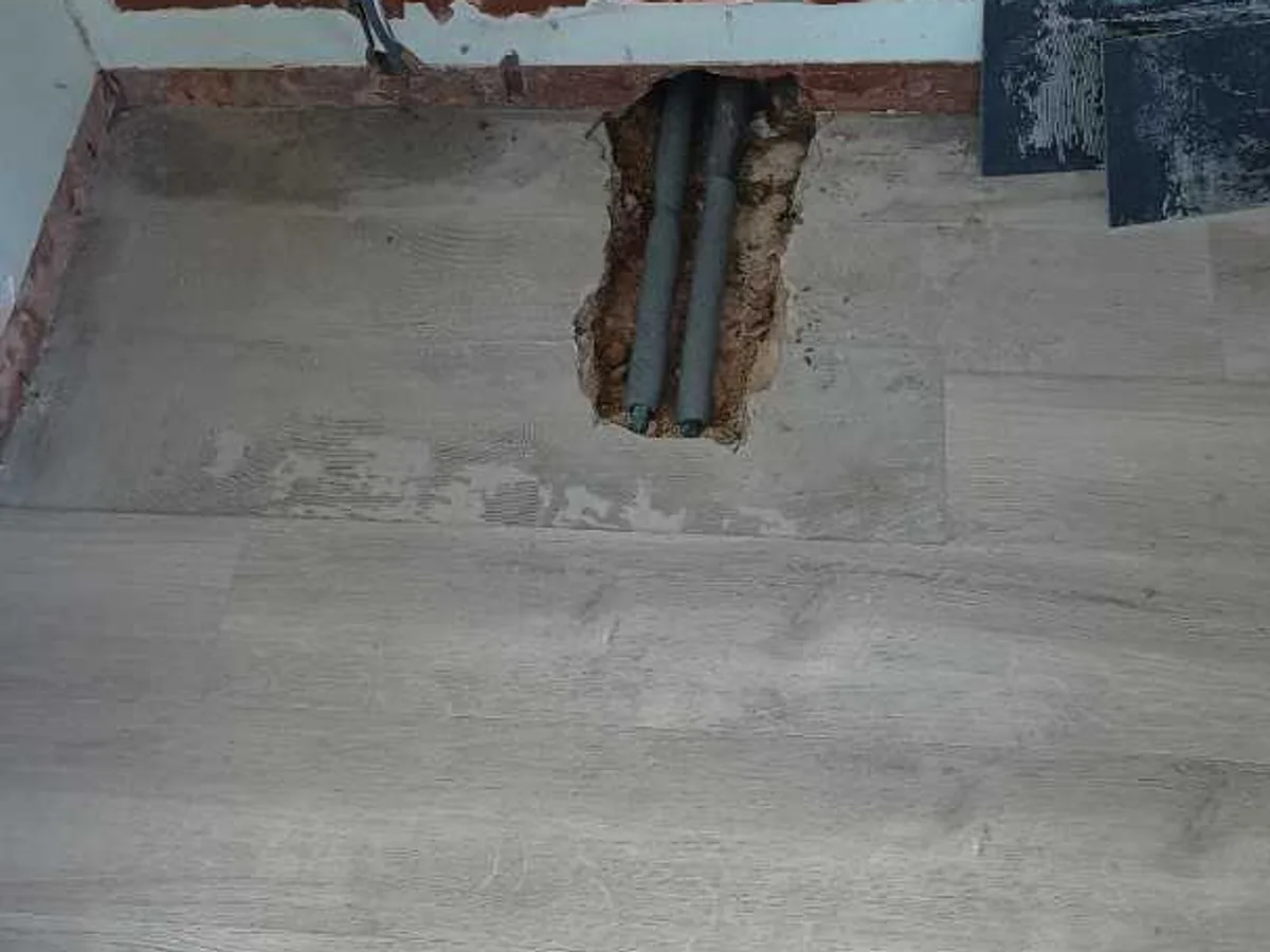 leak located at exposed 15mm copper pipework beneath bathroom floor after concrete broken up