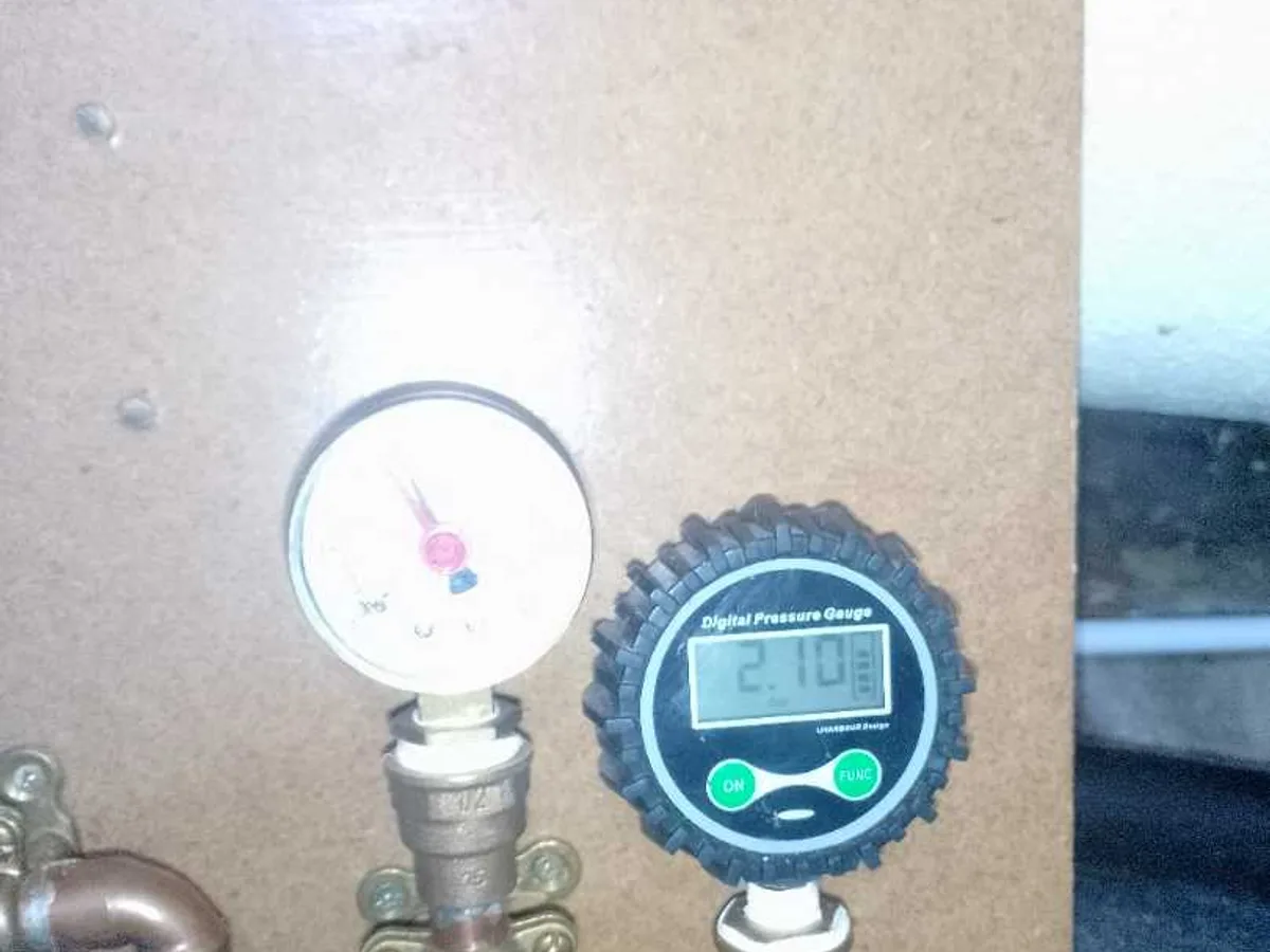 digital pressure gauge reading 2.70 bar confirming successful re-test after works completed