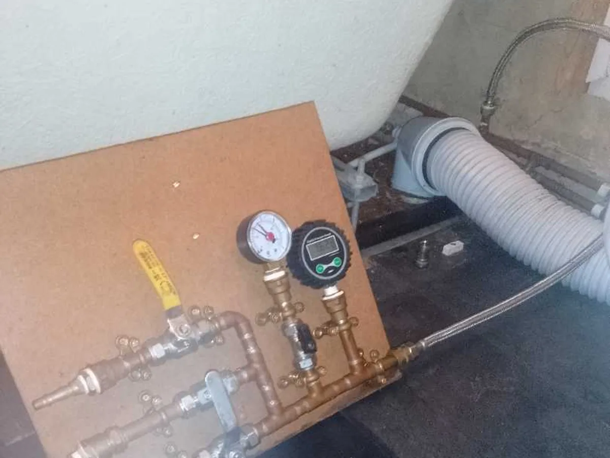 pressure testing rig with analogue and digital gauges connected to pipework during leak detection