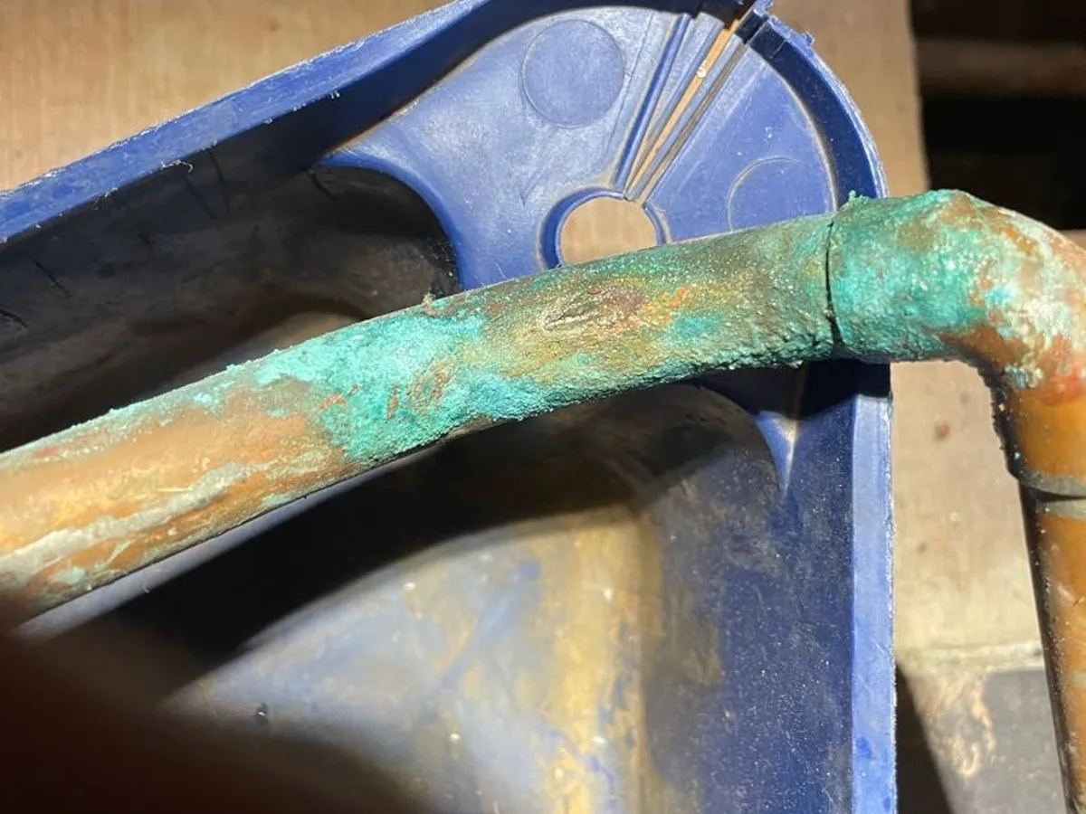 leak located at heavily corroded copper pipe elbow in boiler cupboard sub-floor void