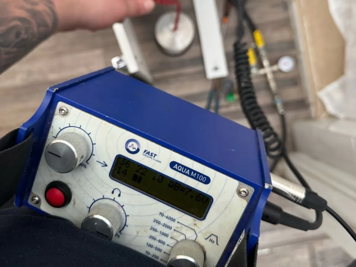 acoustic correlator unit in use beneath basin during leak detection