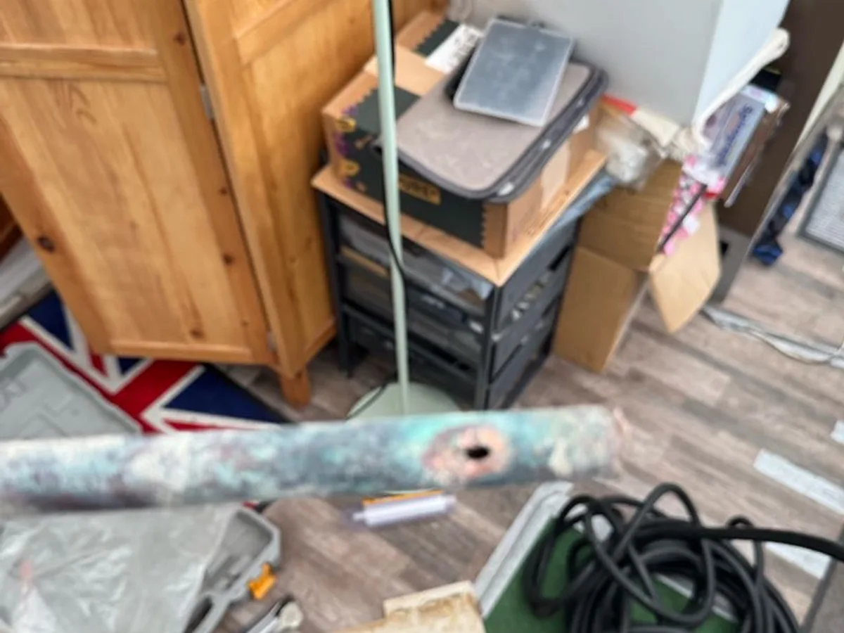 leak located at pinhole in corroded copper pipe beneath concrete floor
