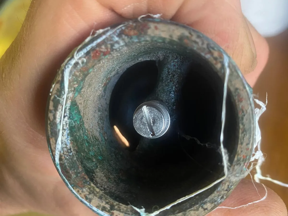 corroded hydrostatic valve body with old PTFE tape visible before works started