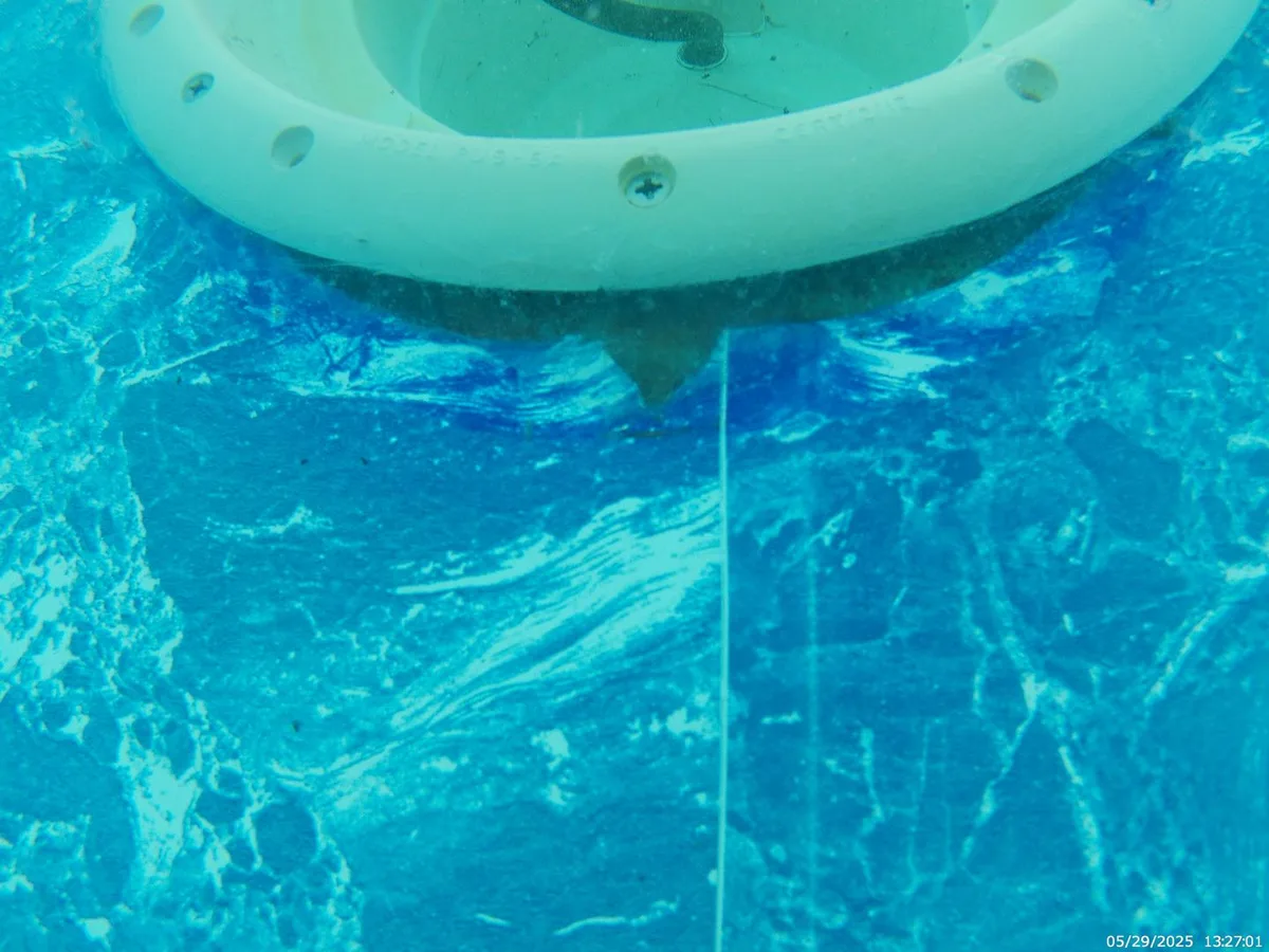 fault identified at pool light frame where liner has torn away from its seal — leak located at