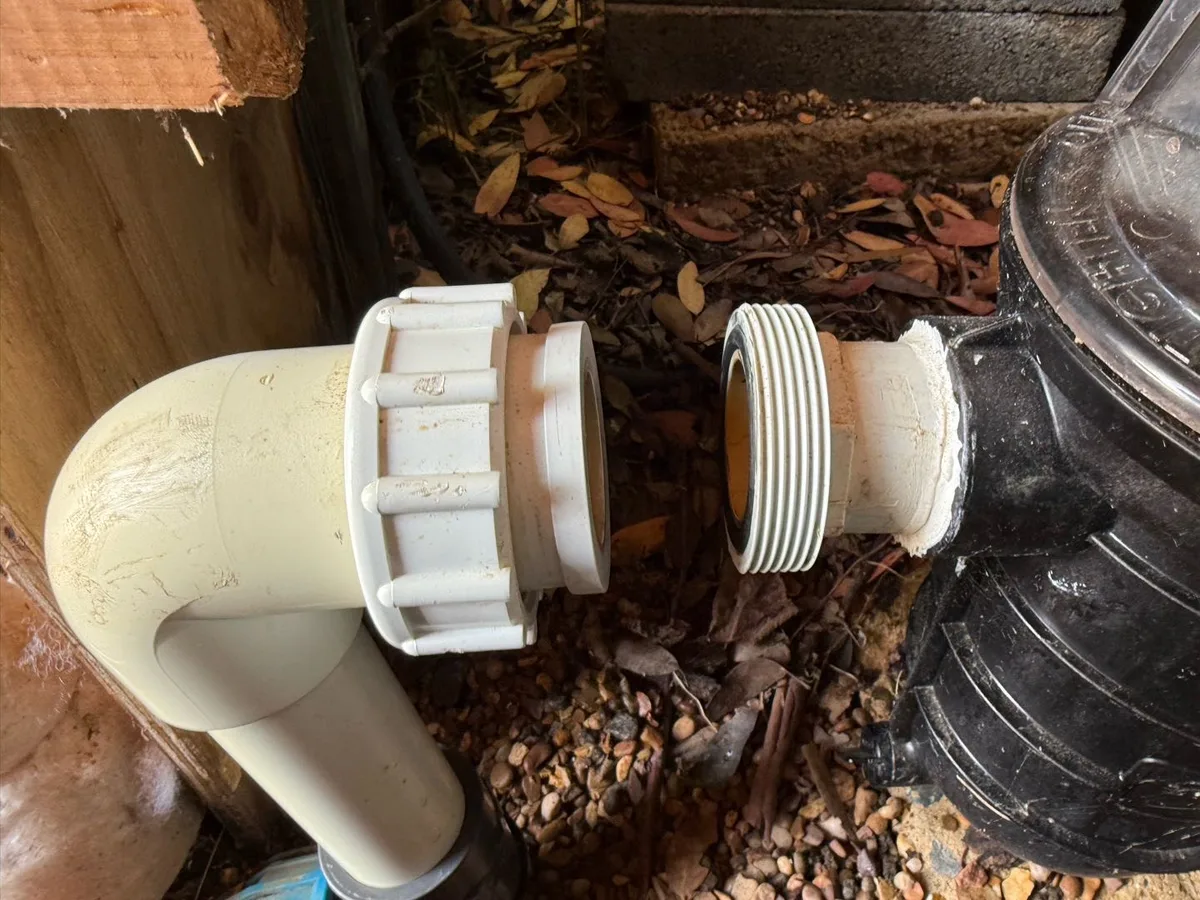 leak found at cracked glued socket on pool-to-mains pipe connection in filtration room