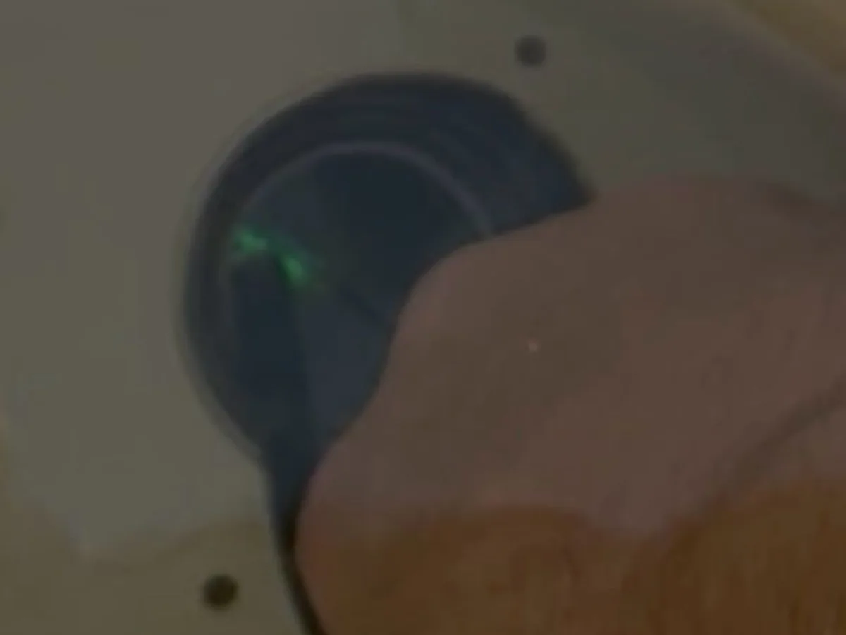 leak located at skimmer body outlet with dye visibly drawn into crack