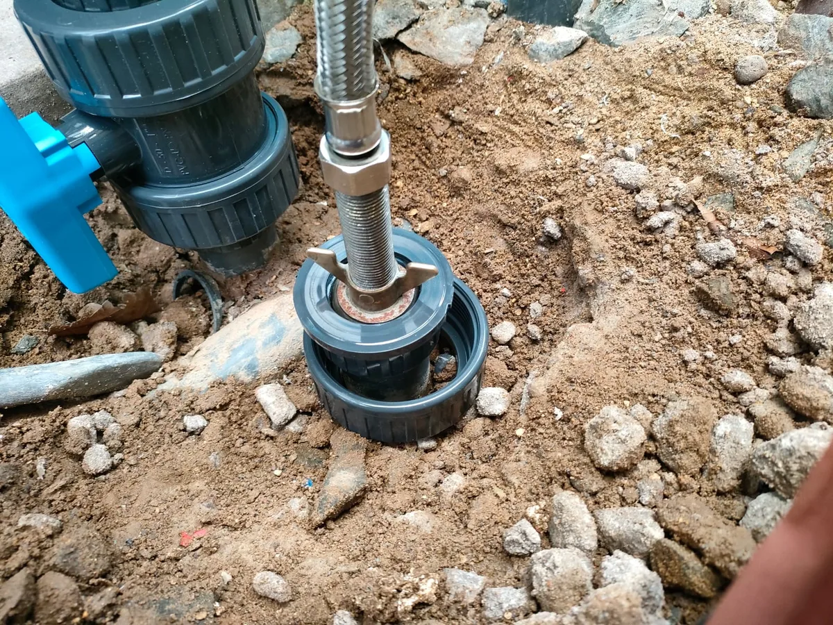 fault identified at skimmer pot union fitting excavated from beneath concrete slab — leak located at