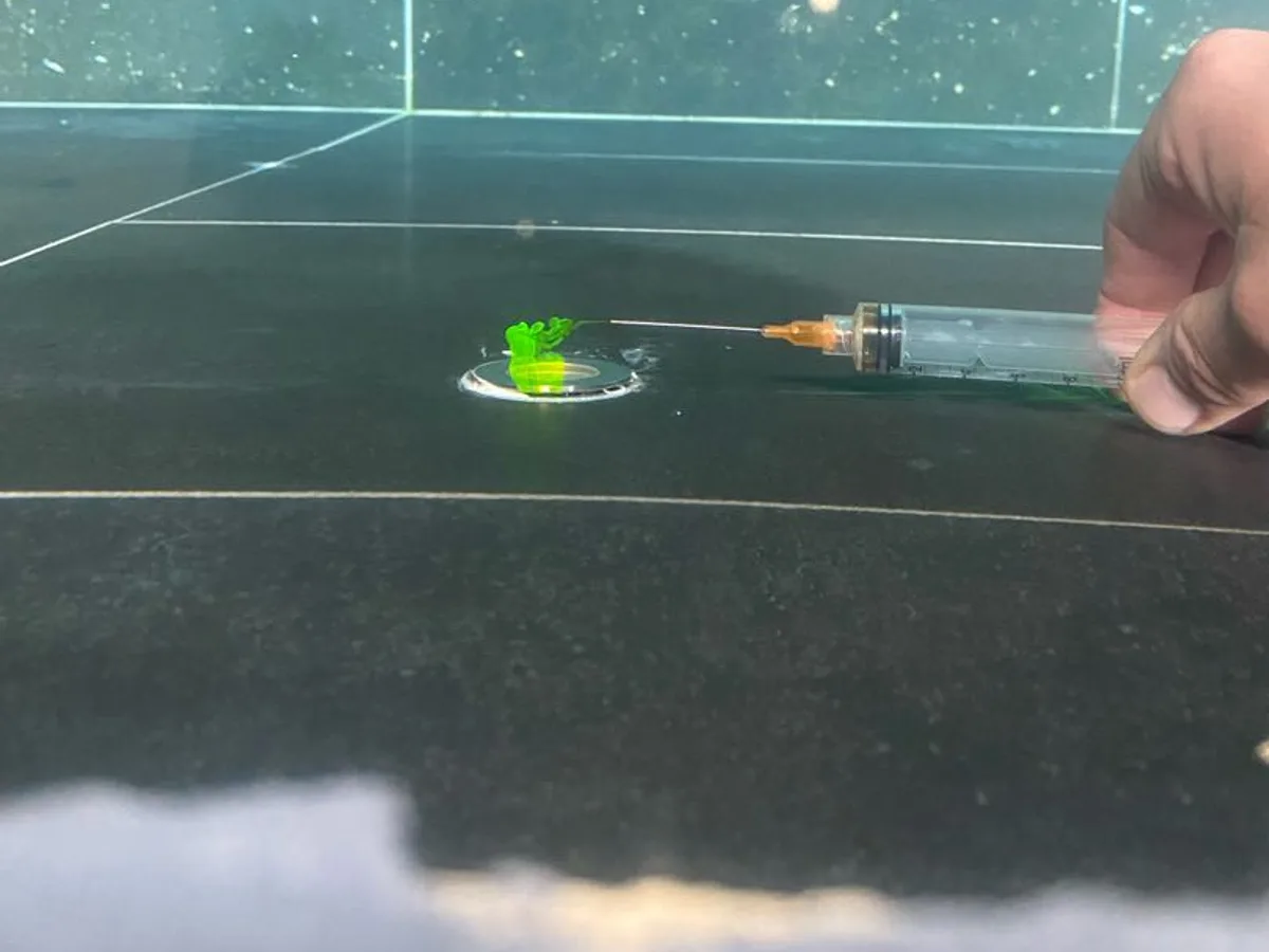 fault identified at pool light fitting with green dye drawn into wall around the seal — leak located at