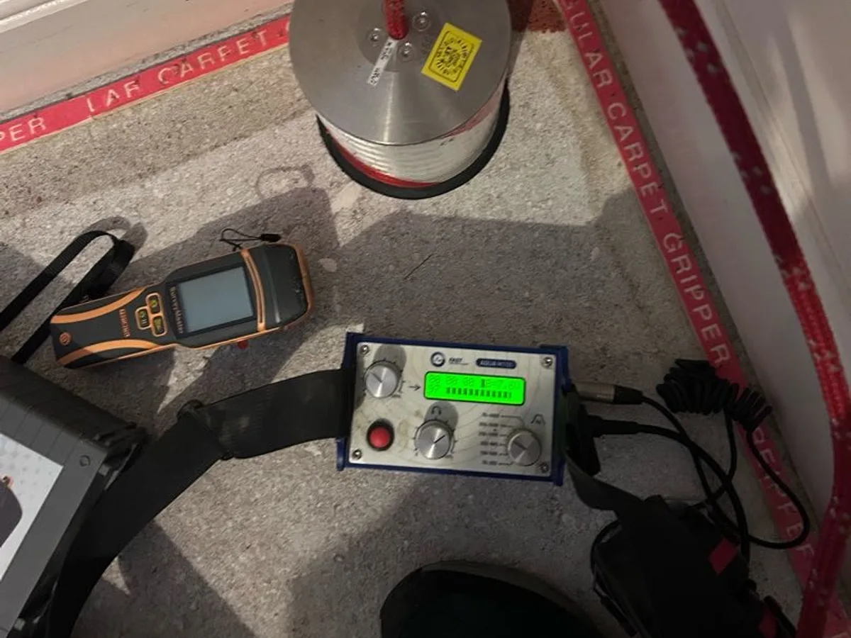 acoustic listening equipment on carpeted floor during leak detection survey