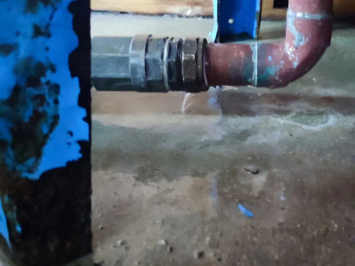 leak located at corroded compression fitting on expansion vessel pipework in pump room