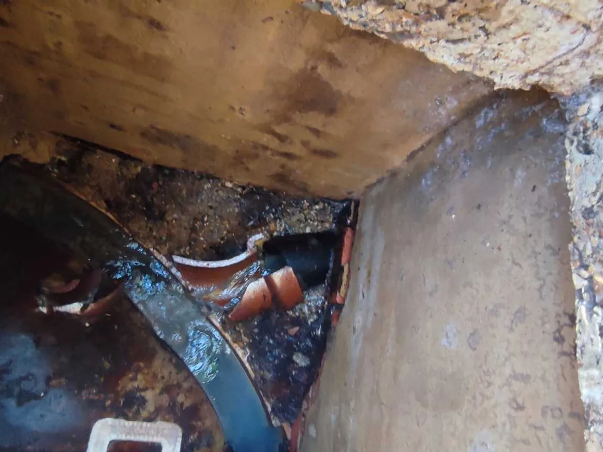 underground pipework chamber with corroded pipes inspected during leak detection