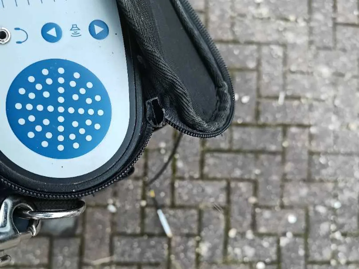 acoustic correlator handset in carry case on block paving driveway during leak detection