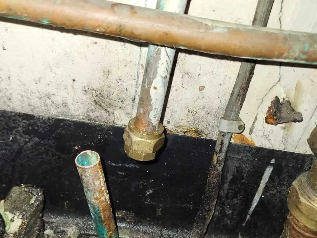 15mm compression stop end cap fitted to teacher desk tap supply pipe as repair completed