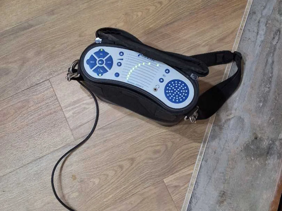 tracer gas detector unit on kitchen floor during leak detection survey