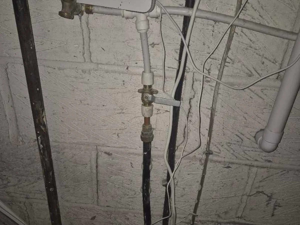 internal stop cock and rising mains pipework in garage during leak detection survey