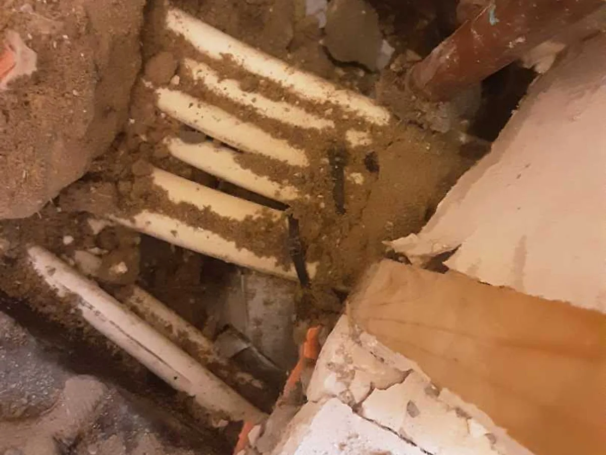 fault exposed at copper cold mains pipework buried in concrete floor beneath hallway cupboard
