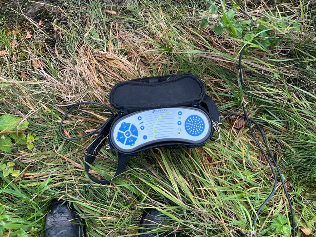 acoustic correlator unit placed on grass during leak detection survey