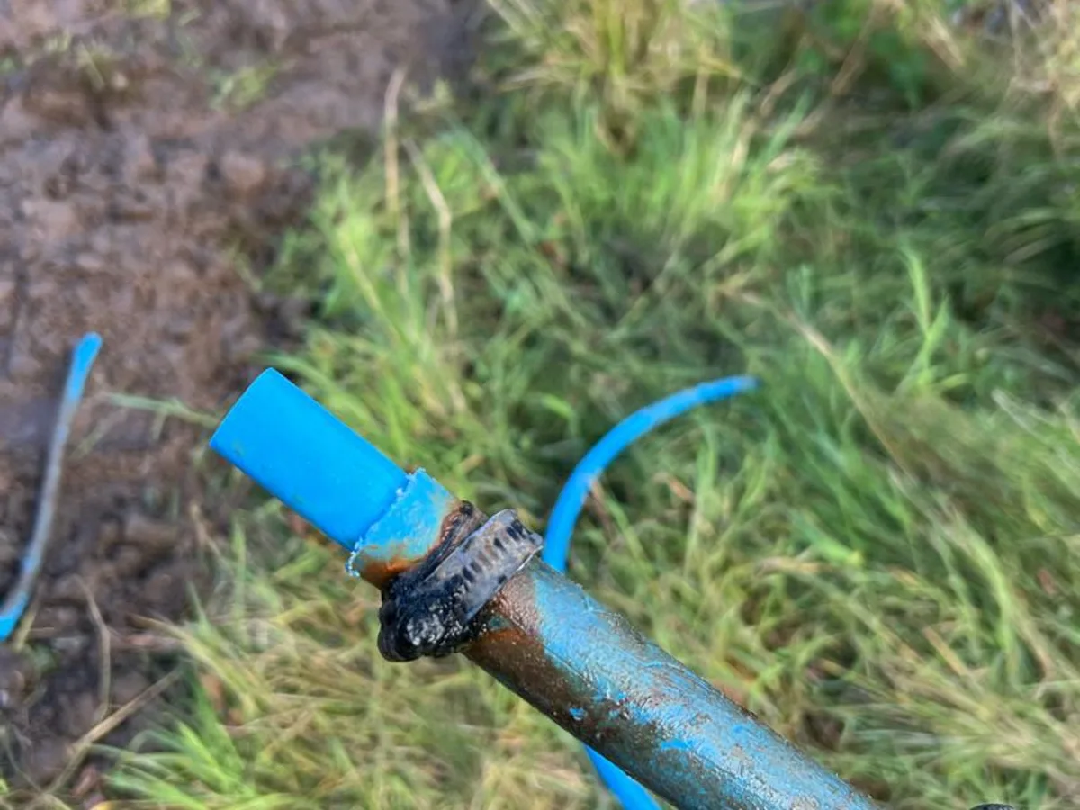 leak found at corroded joint between blue MDPE and metal mains pipe caused by installation fault