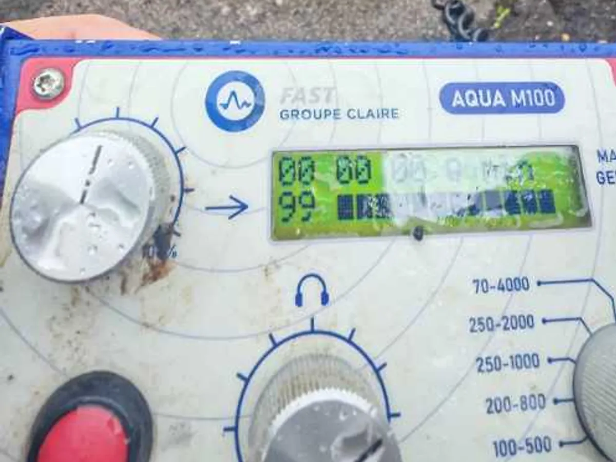 acoustic correlator unit with sensor on tarmac patch during leak detection survey