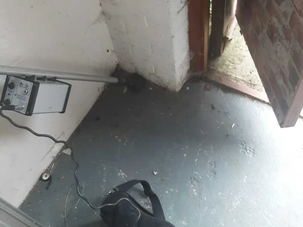 acoustic listening device placed at garage doorway during leak detection survey