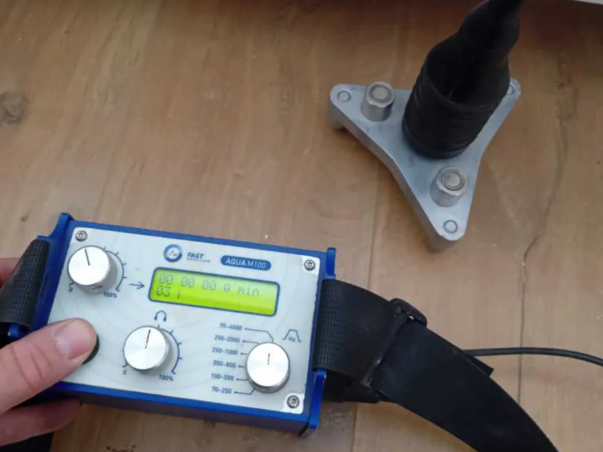 acoustic listening device with floor sensor on timber floor during leak detection investigation