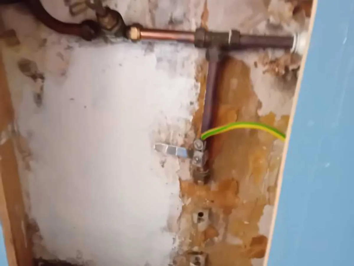 capped pipework with pressure test manifold after repair completed on internal cold supply