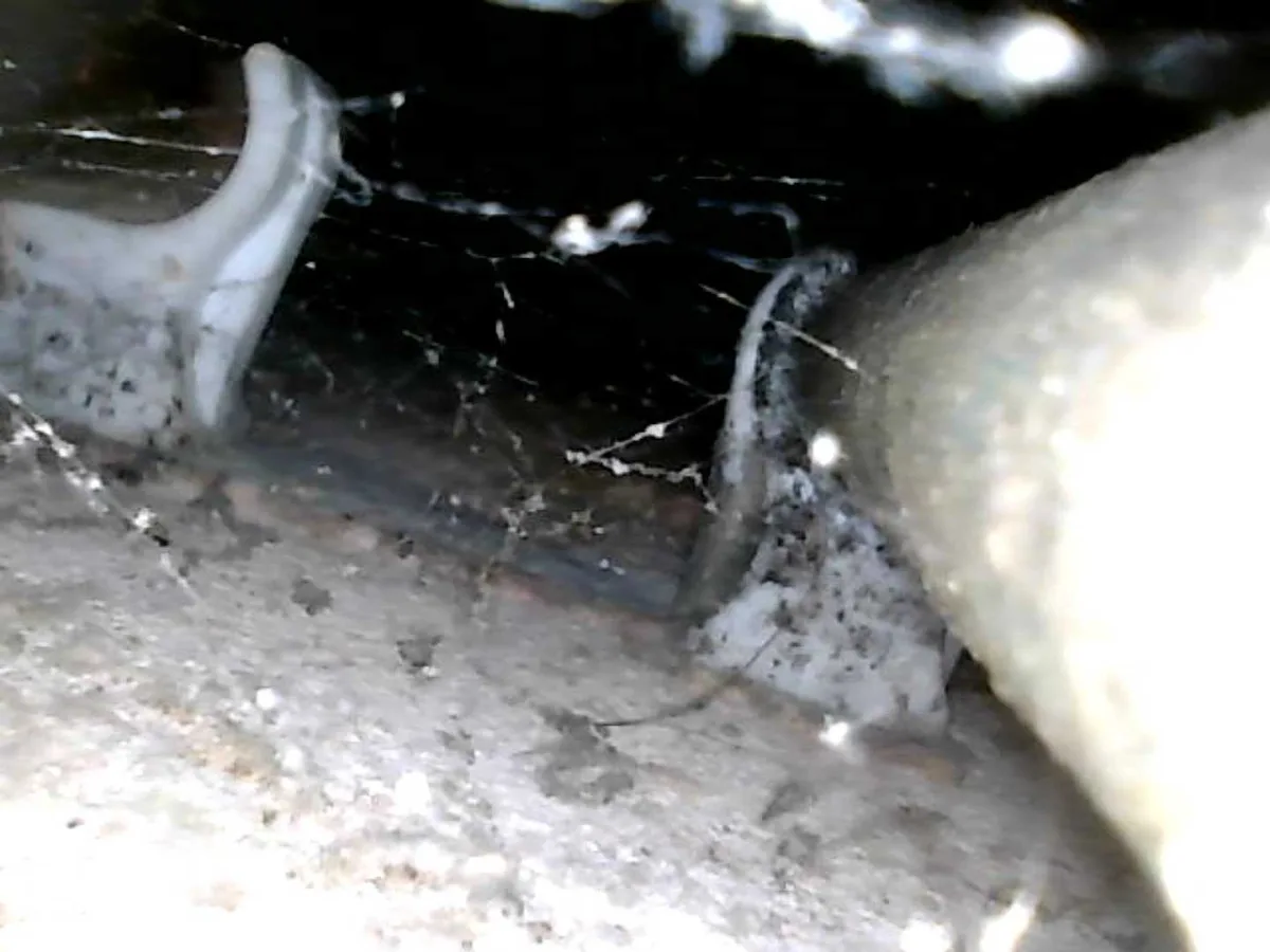 endoscope view of pipework in concealed void under kitchen unit during leak detection