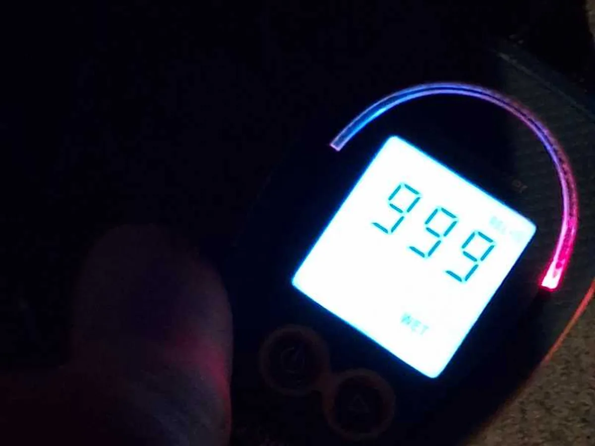 moisture meter reading 999 indicating saturated material during leak detection