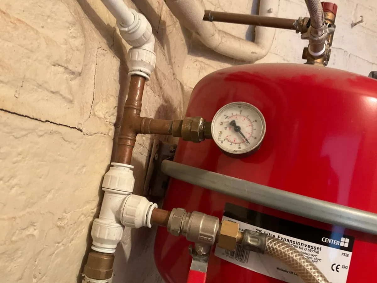 boiler room expansion vessel and pipework reinstated after repair to underground mains