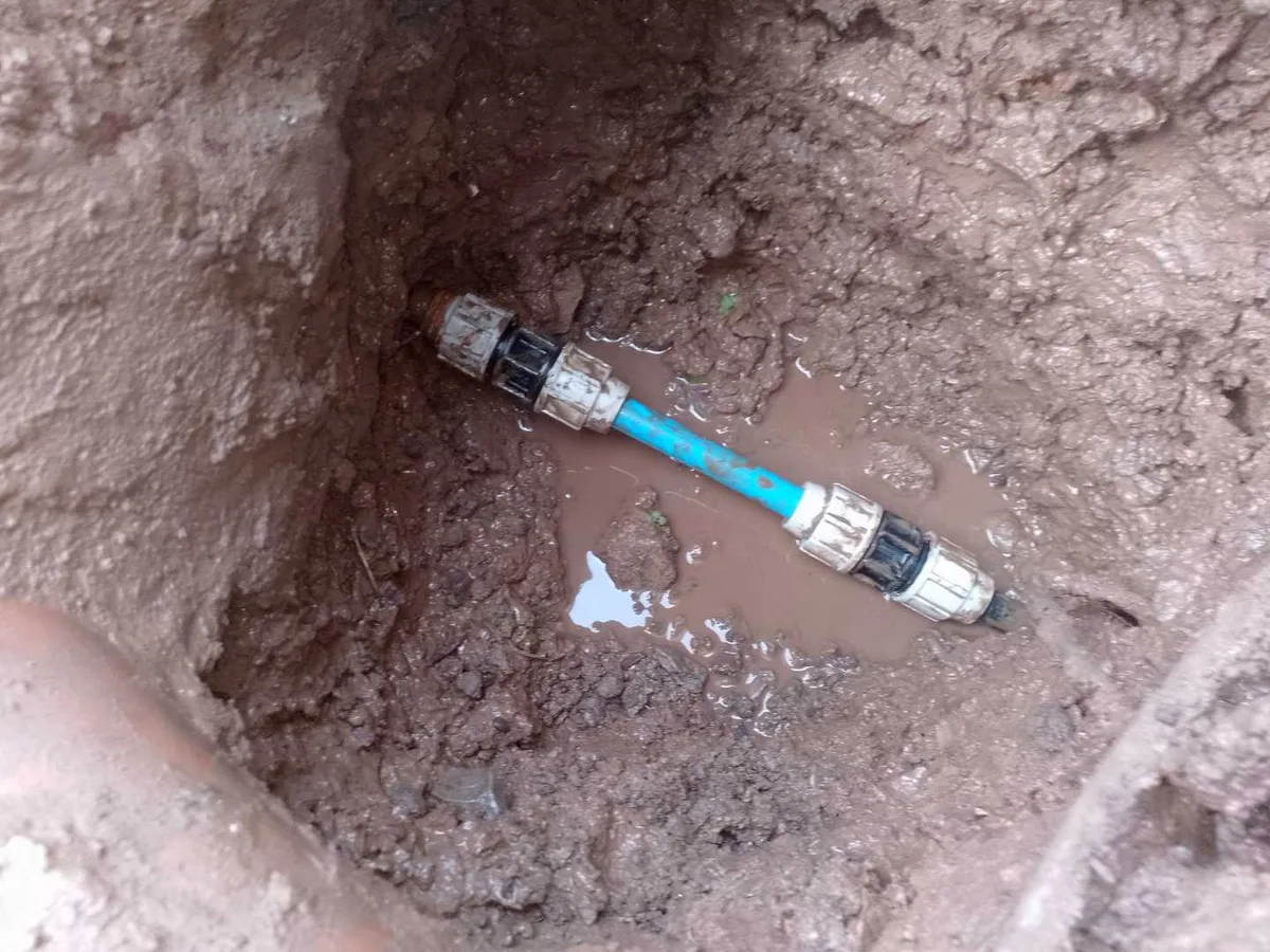 new transfer couplers and replacement mains pipe section installed as repair completed in excavation
